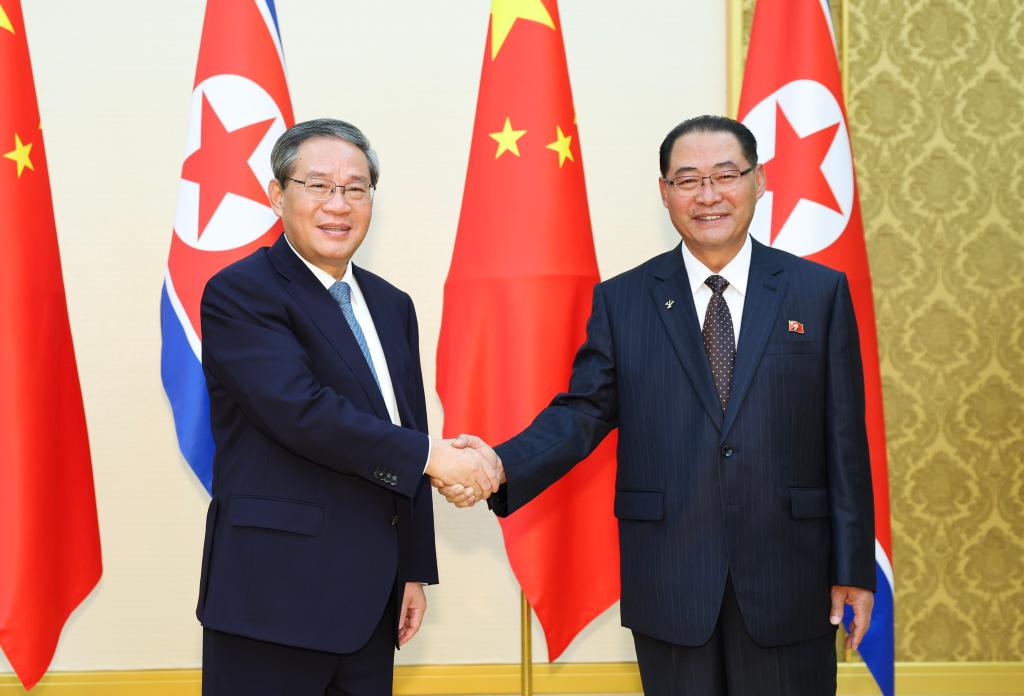 李強氏、朝鮮首相と会談